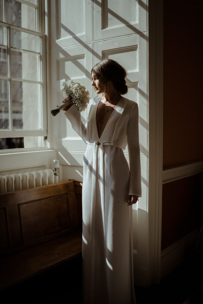 An elegant long sleeve Galvan London dress for city elopement bride Katja