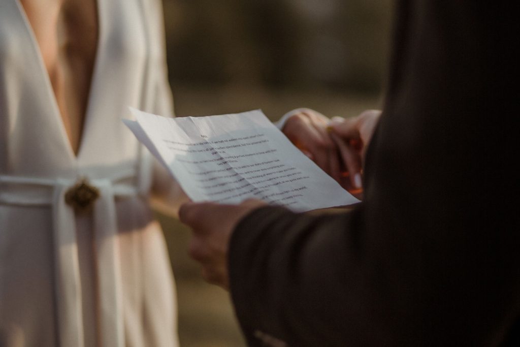 Dom reading his personalised vows to Katja as the warm summer sun slowly sets