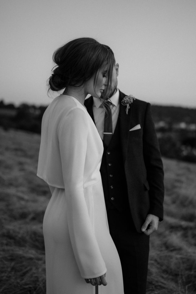 A intimate sunset moment for two newly weds on their wedding day