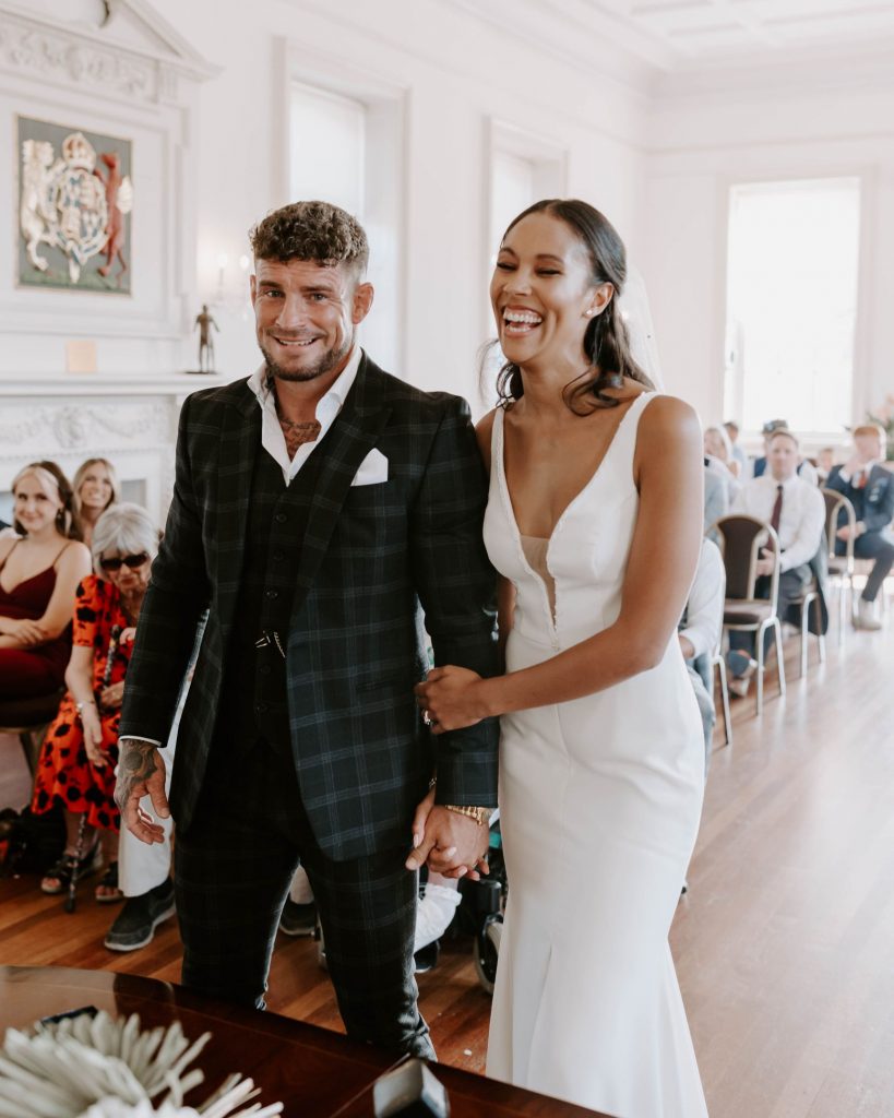A bride and groom to be enjoying their wedding ceremony