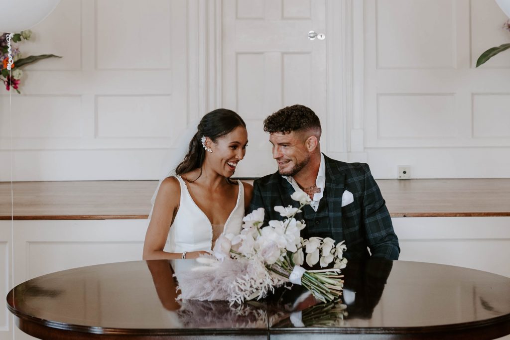 Newlyweds take a moment of calm after their wedding ceremony