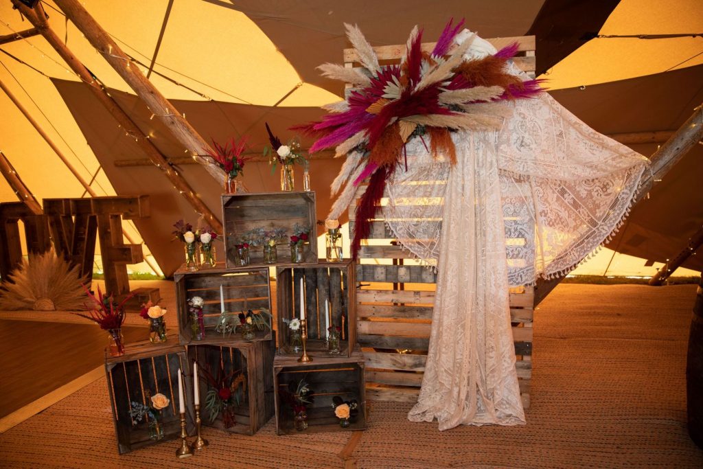 Boho style wedding dress with lashings of lace for tipi wedding