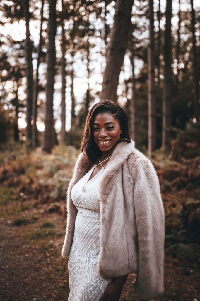 Bride Olivia in her faux coat during her intimate wedding day shoot