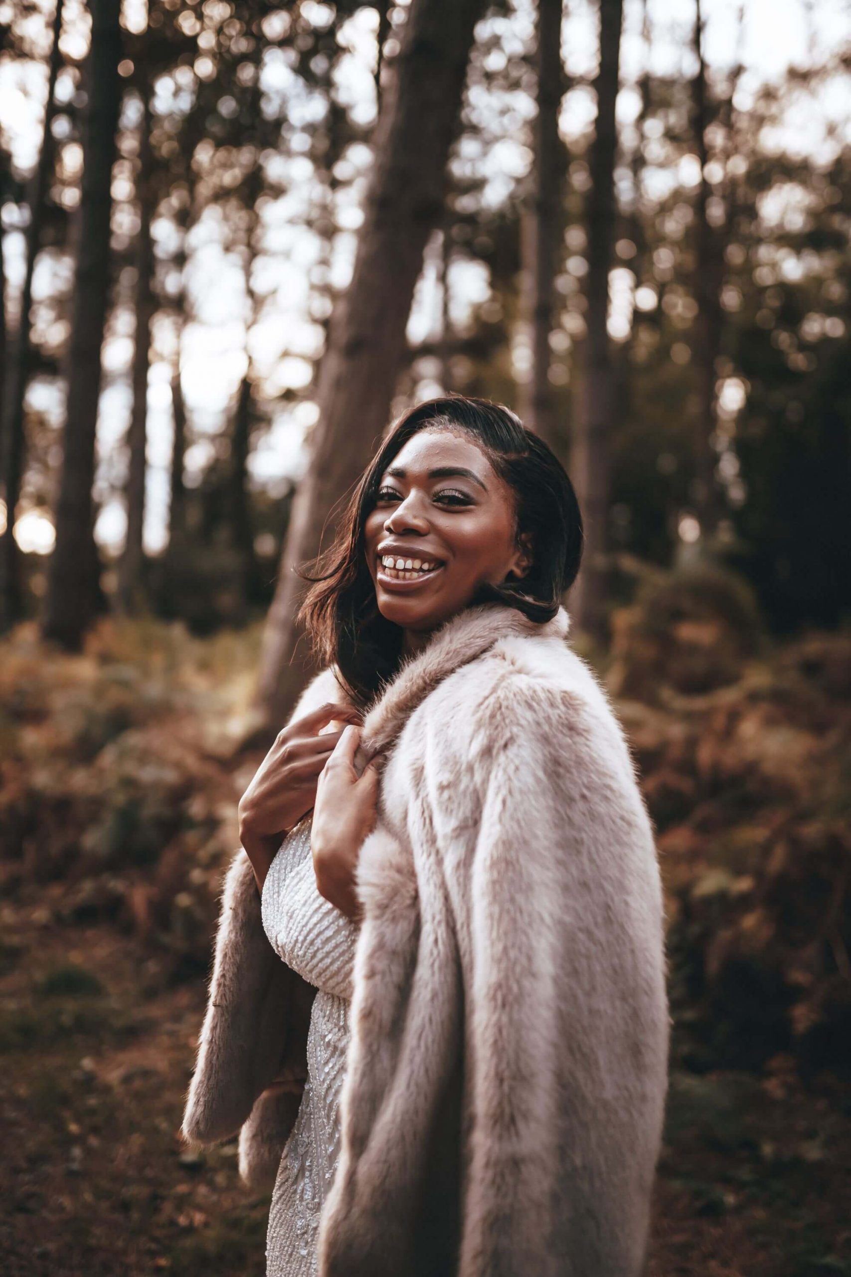 Beautiful bride Olivia in faux fur captured by Blonde Shot Photography