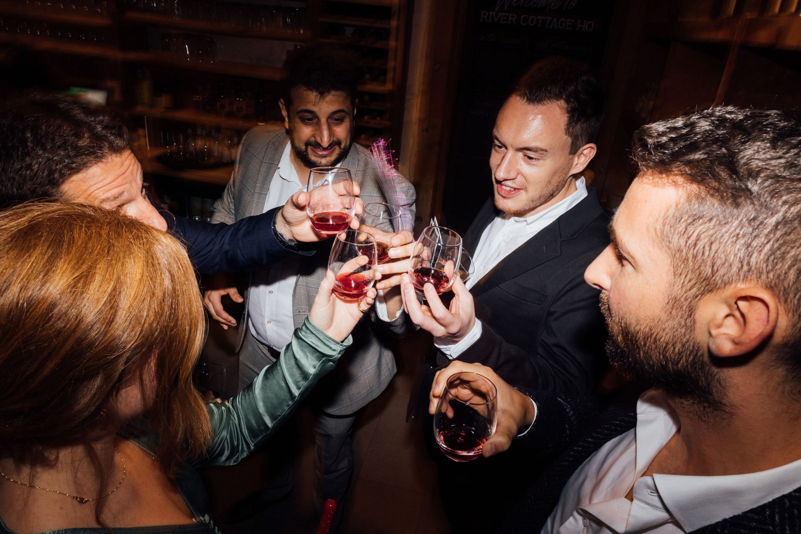 Cheers! Guests getting into the party spirit for Louise and Simon's wedding day