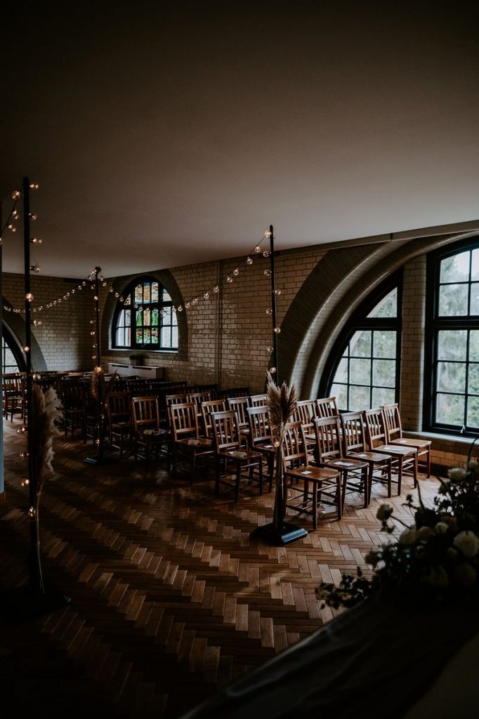 Festoon lighting decorating the ceremony space at The Pumping House
