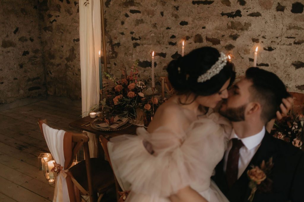 Nicole Milano gown for rustic barn wedding