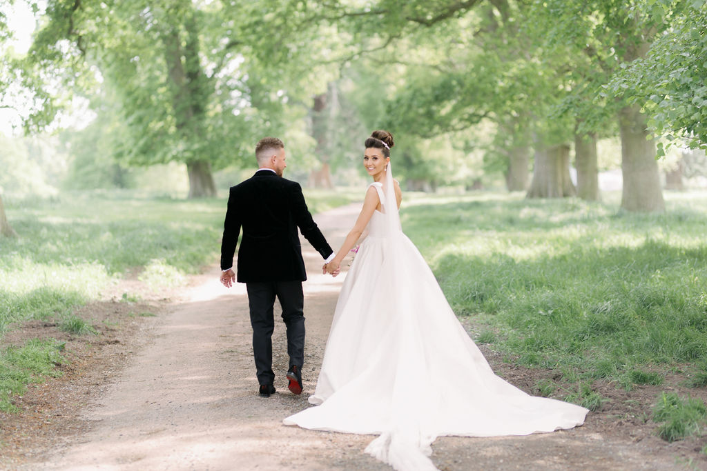 An elegant and romantic pink and gold wedding at Davenport House with two Milla Nova dresses