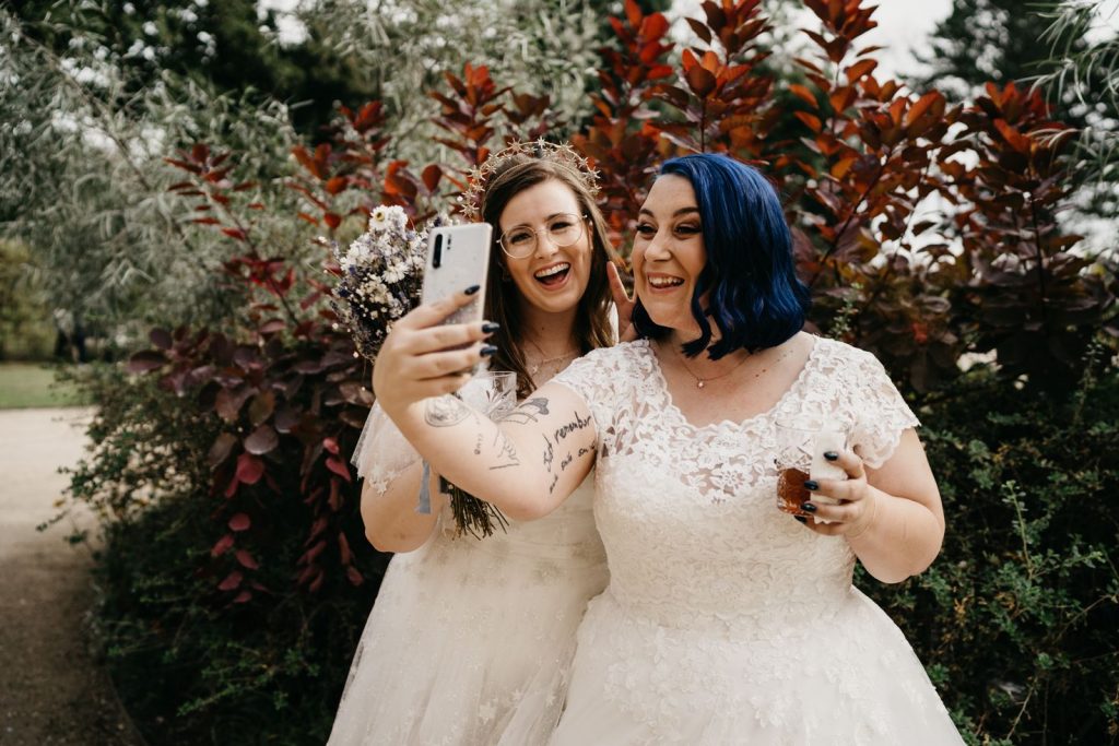 A joyous Queer wedding celebration at Newton Hall for celestial brides captured by David Boynton