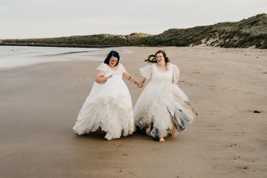 A joyous Queer wedding celebration at Newton Hall for celestial brides captured by David Boynton