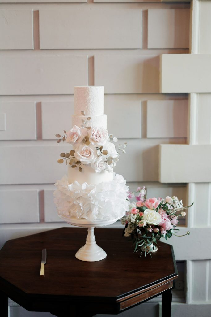 An elegant and romantic pink and gold wedding at Davenport House with two Milla Nova dresses