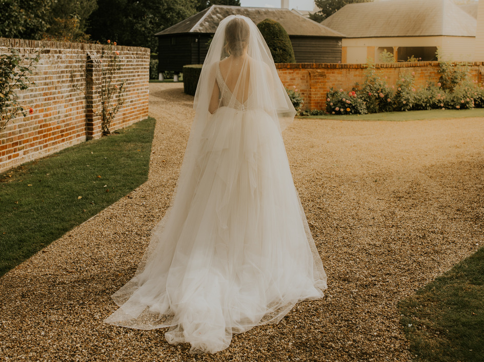 An evening outfit change for an elegant Autumnal bride at Blake Hall