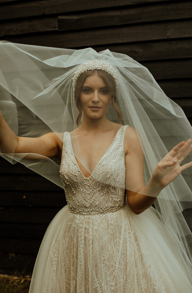 An evening outfit change for an elegant Autumnal bride at Blake Hall