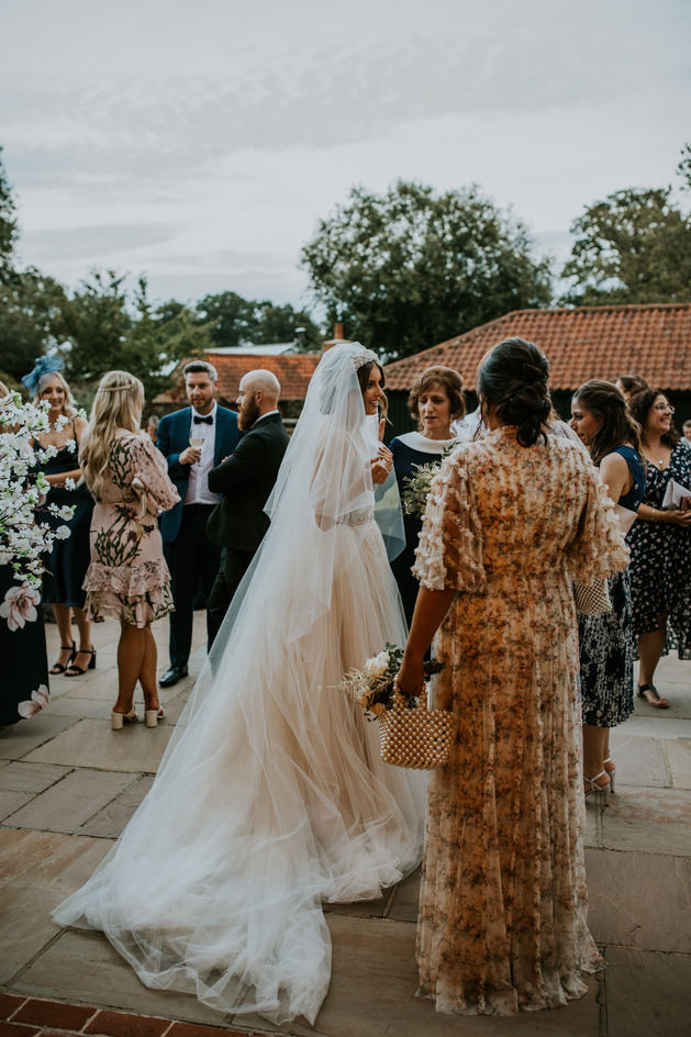 An evening outfit change for an elegant Autumnal bride at Blake Hall