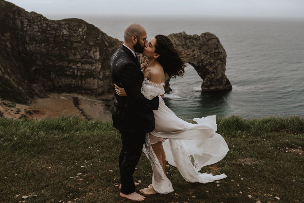 A bespoke wedding dress for a barefoot bohemian bride and a rainy beach elopement