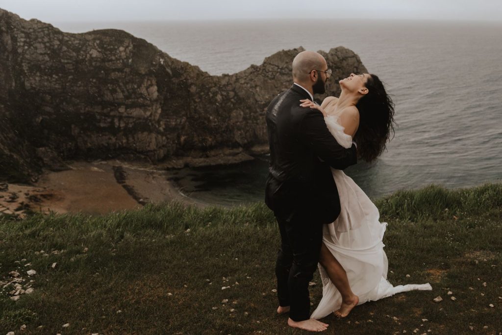 A bespoke wedding dress for a barefoot bohemian bride and a rainy beach elopement