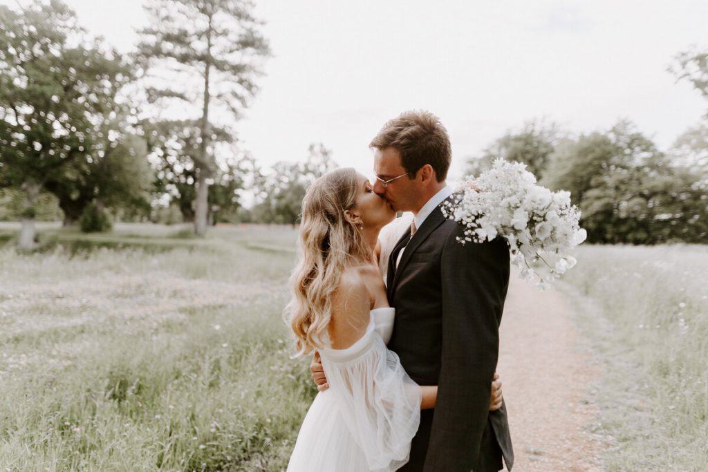 A newlywed kiss for Ariel + Charlie during their summer's wedding at Wilderness Reserve | Sharon Cudworth Photography