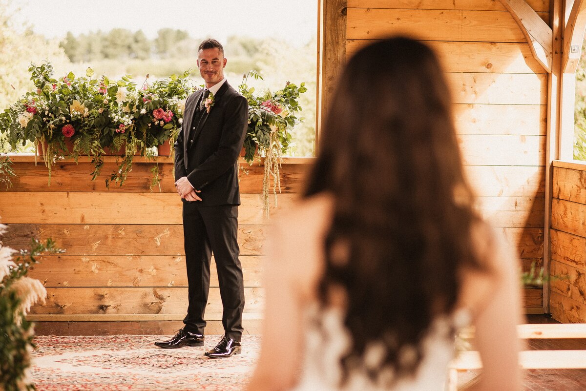 Boho luxe wedding ceremony styling within a modern bran style ceremony space