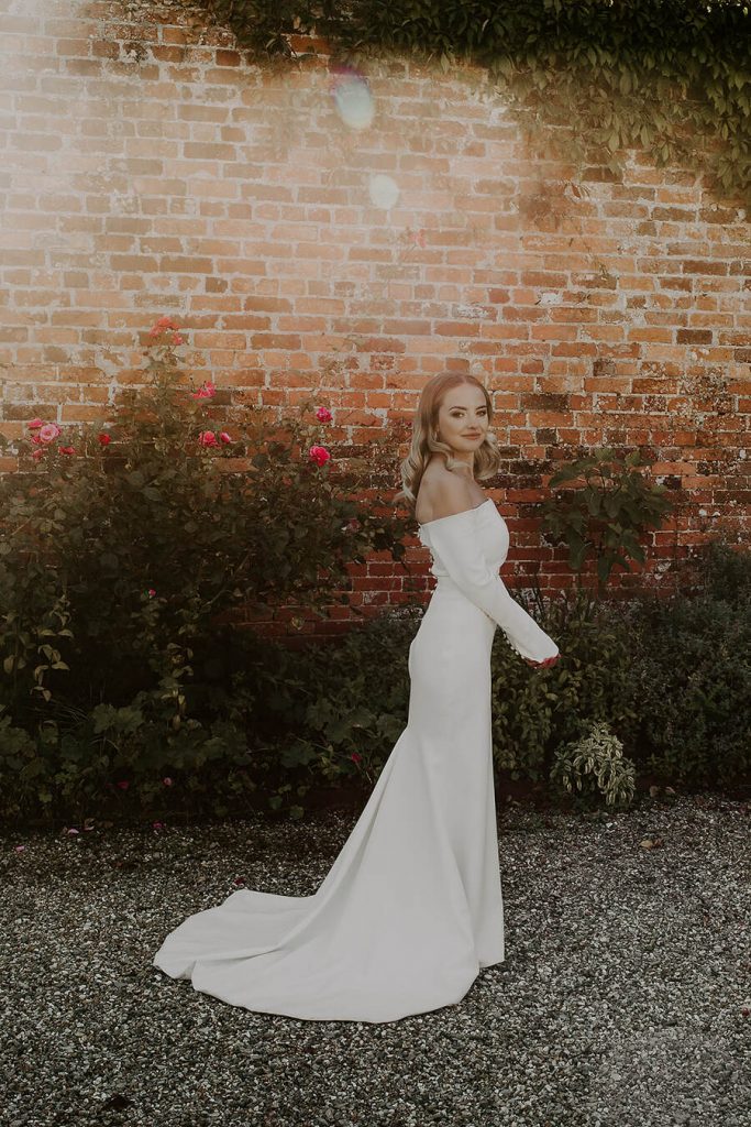 Minimalist wedding style for bride Sophie in a long sleeved Milla Nova dress