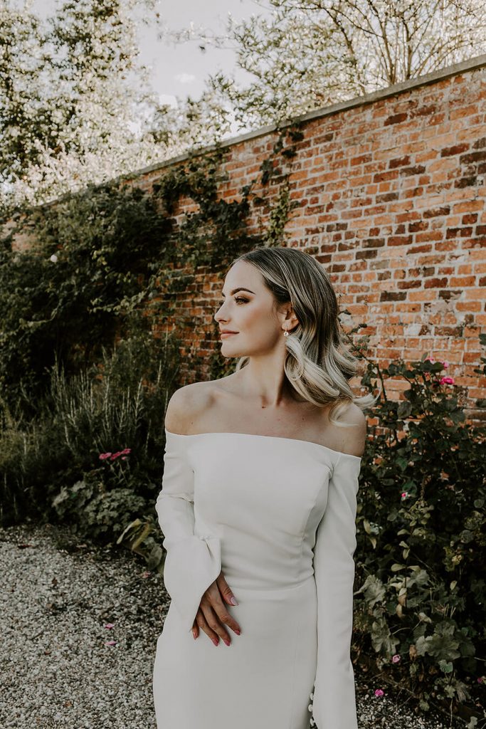 Minimalist wedding style for bride Sophie in a long sleeved Milla Nova dress