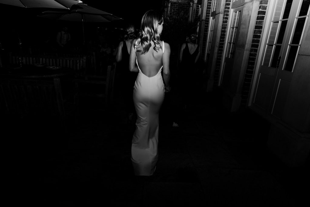 An evening outfit change for Elmhay Park bride into a minimalist wedding slip for a chic, elegant party look
