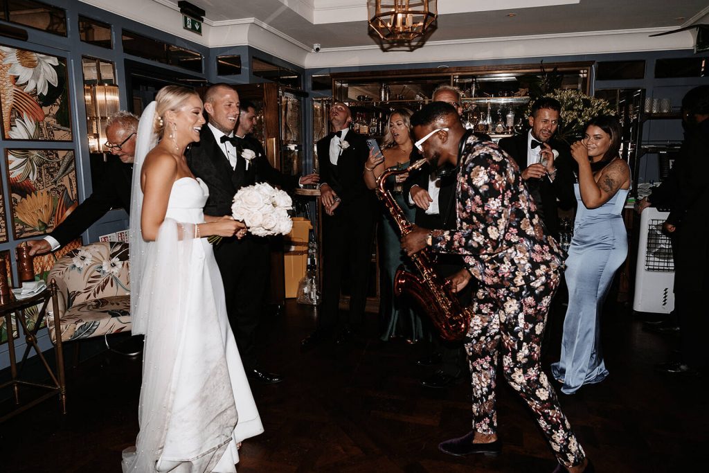 A surprise greeting by a saxophonist at The Ivy Tower Bridge