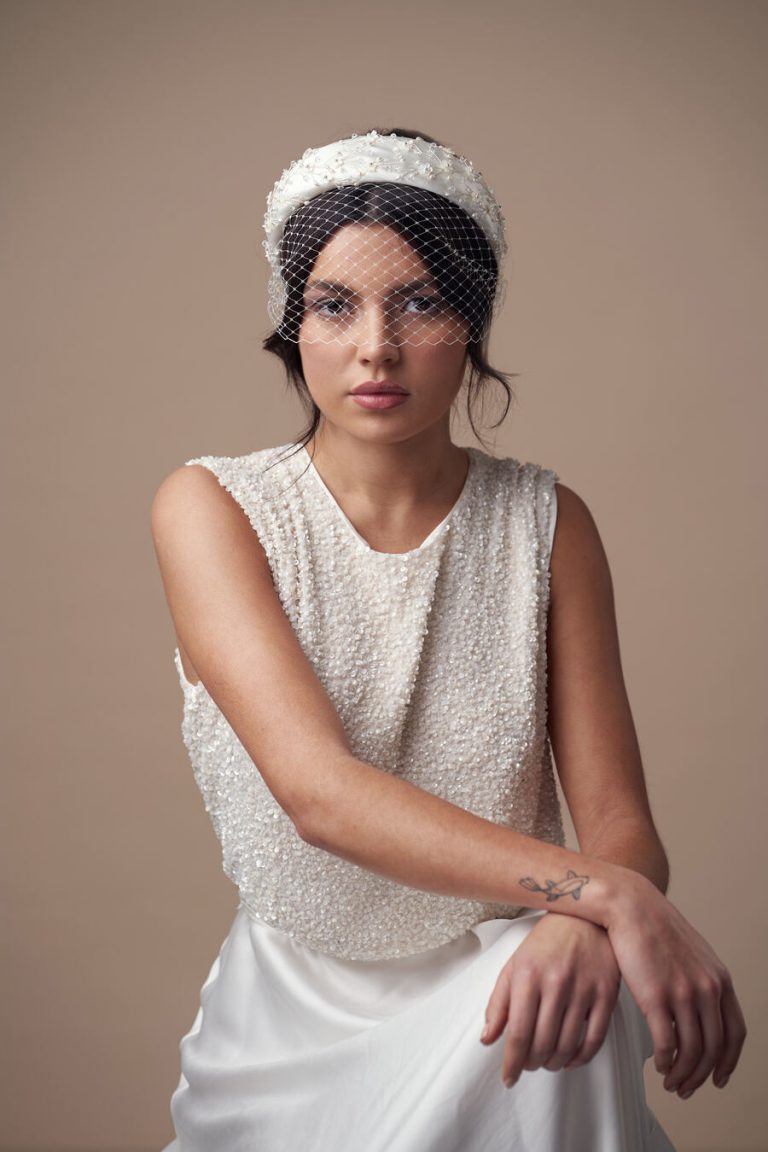 Chic ivory padded headband with floral beading and birdcage wedding veil by Debbie Carlisle