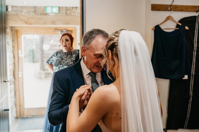 Paige + Ash's wedding day at Dodford Manor featuring a colourful hand painted wedding dress by Savin London