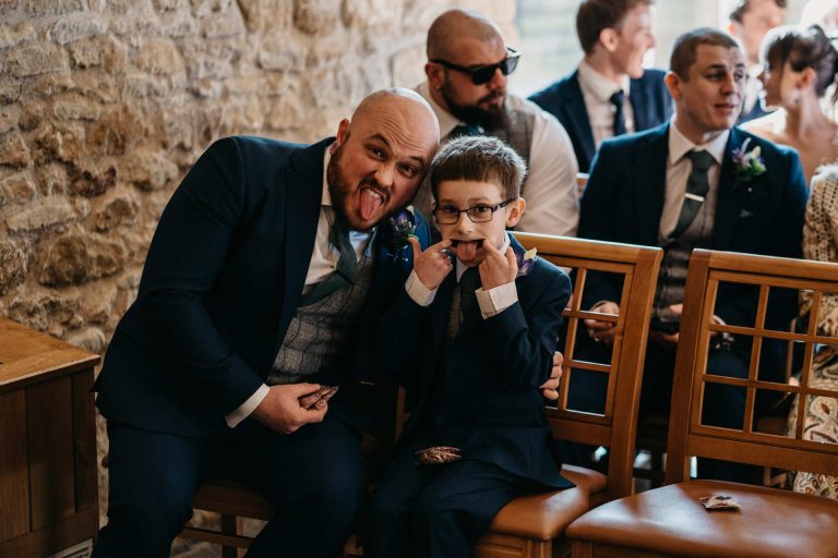 Paige + Ash's wedding day at Dodford Manor featuring a colourful hand painted wedding dress by Savin London
