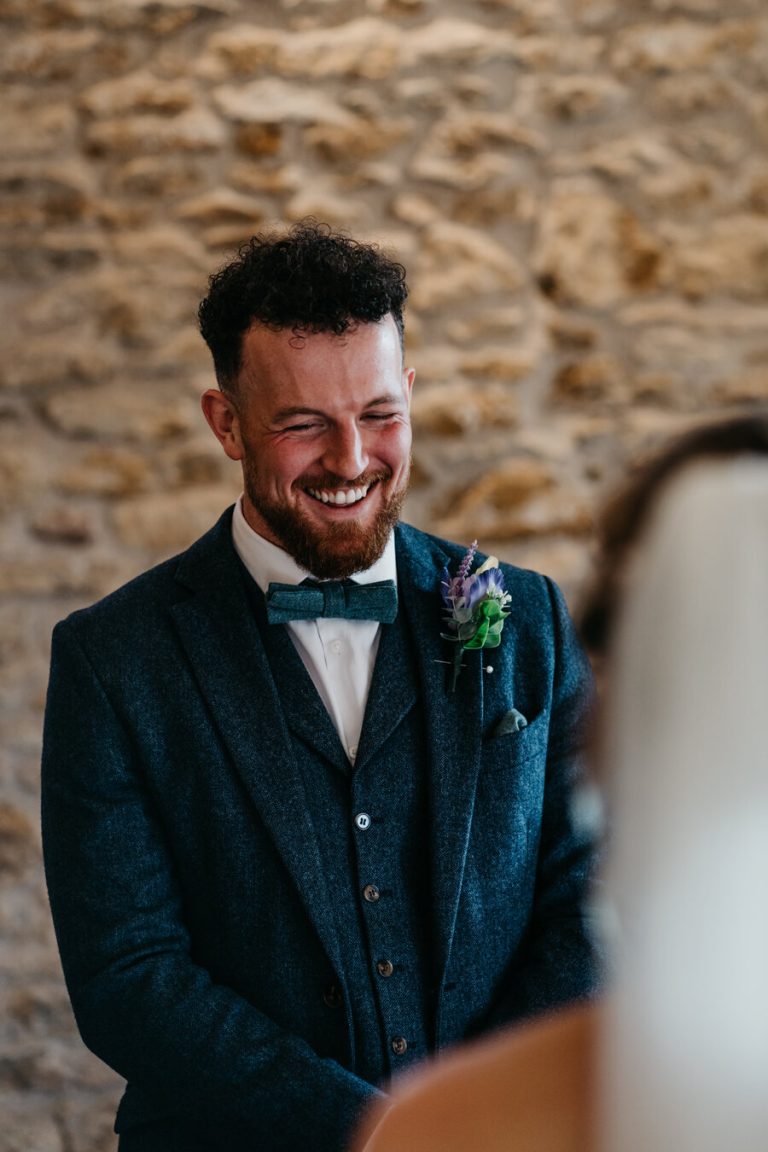 Paige + Ash's wedding day at Dodford Manor featuring a colourful hand painted wedding dress by Savin London