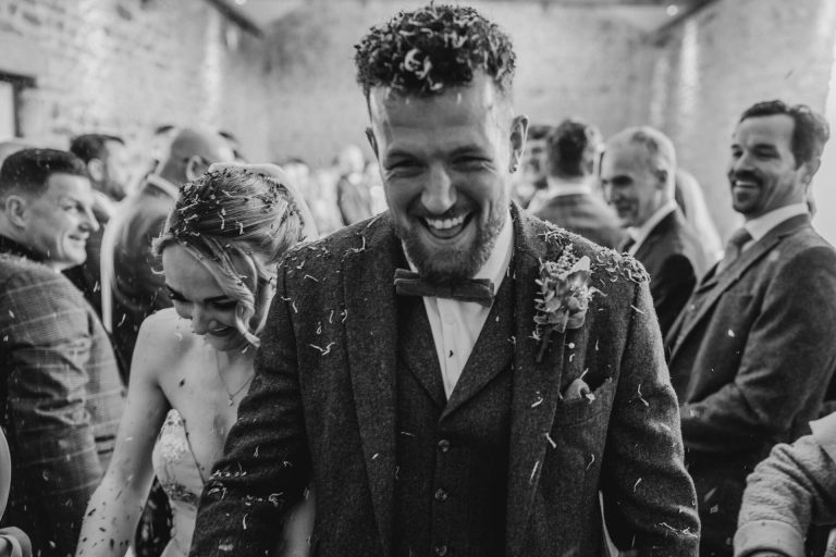 Paige + Ash's wedding day at Dodford Manor featuring a colourful hand painted wedding dress by Savin London