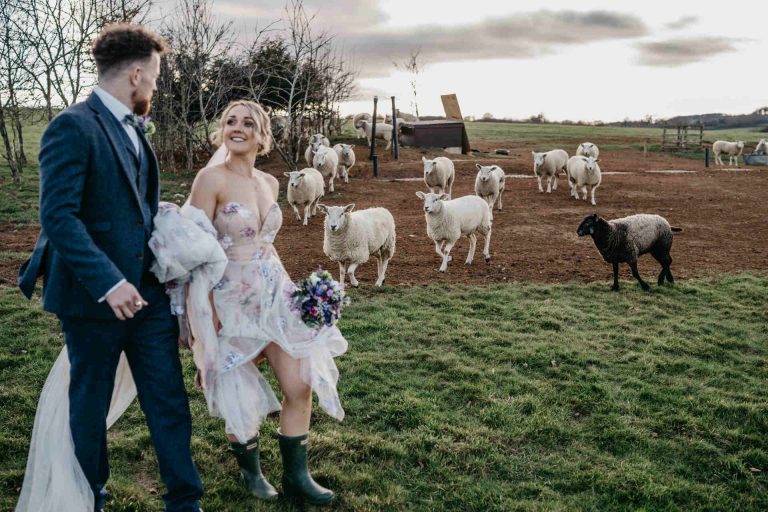 Paige + Ash's wedding day at Dodford Manor featuring a colourful hand painted wedding dress by Savin London
