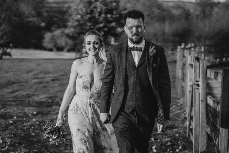 Paige + Ash's wedding day at Dodford Manor featuring a colourful hand painted wedding dress by Savin London