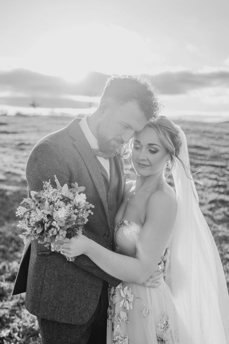 Paige + Ash's wedding day at Dodford Manor featuring a colourful hand painted wedding dress by Savin London