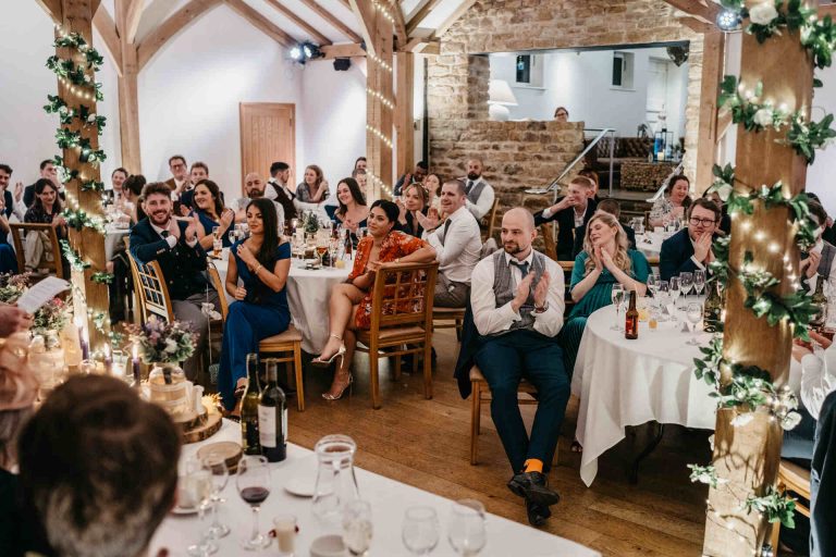 Paige + Ash's wedding day at Dodford Manor featuring a colourful hand painted wedding dress by Savin London