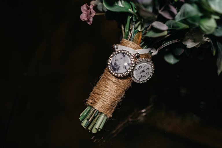Paige + Ash's wedding day at Dodford Manor featuring a colourful hand painted wedding dress by Savin London