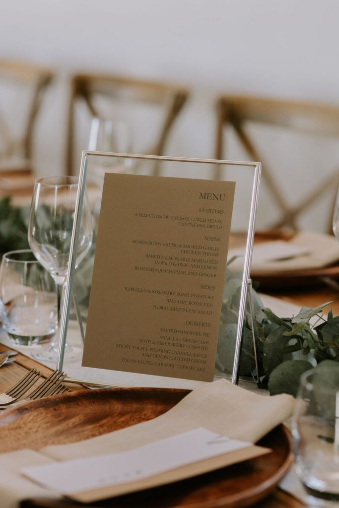 A warm, neutral colour palette with hints of wood, elevated with wildflowers and pampas