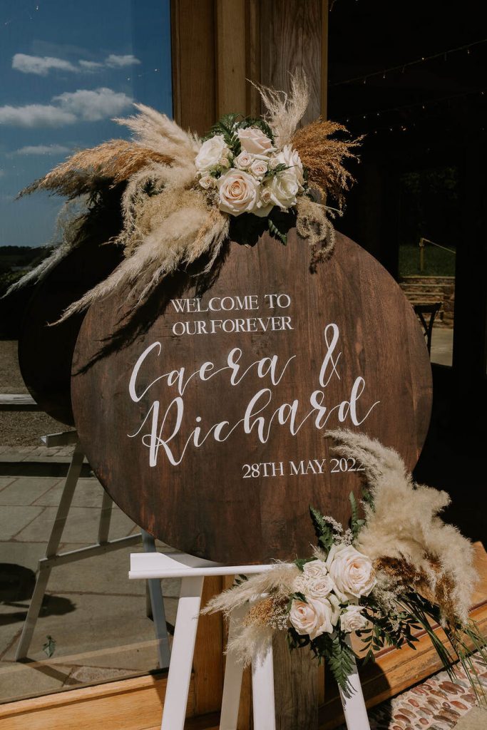 A warm, neutral colour palette with hints of wood, elevated with wildflowers and pampas