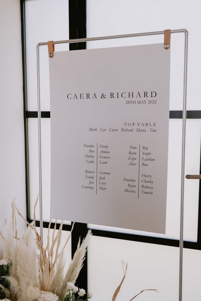 A warm, neutral colour palette with hints of wood, elevated with wildflowers and pampas
