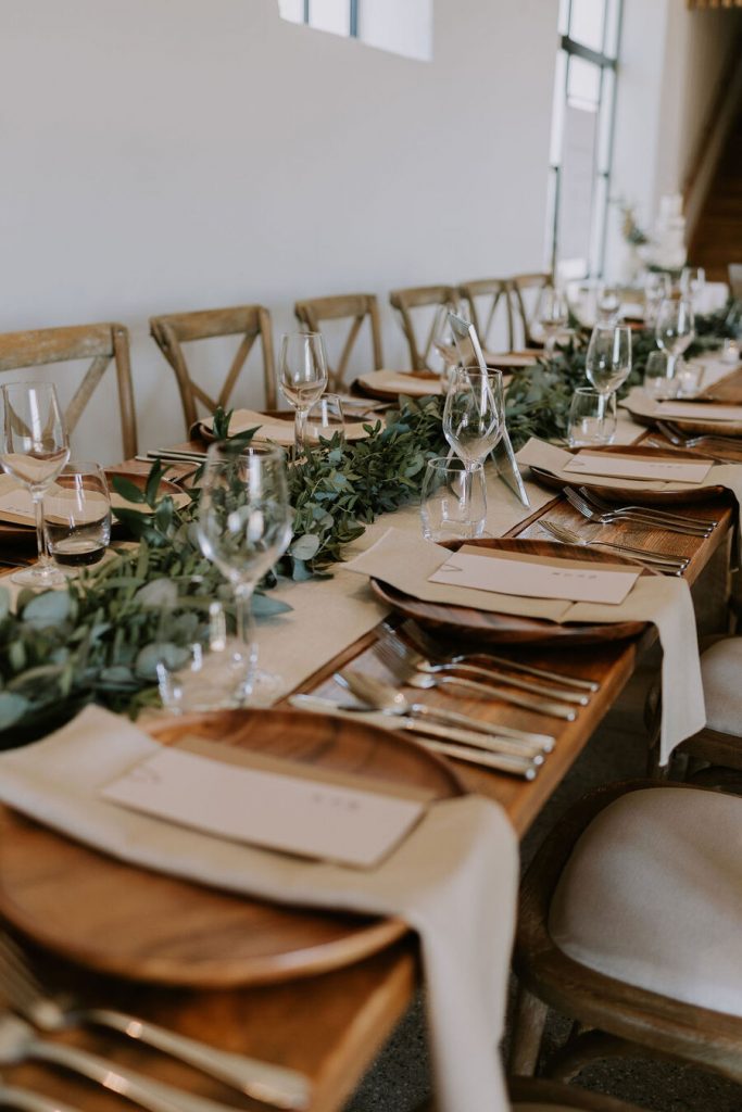A warm, neutral colour palette with hints of wood, elevated with wildflowers and pampas