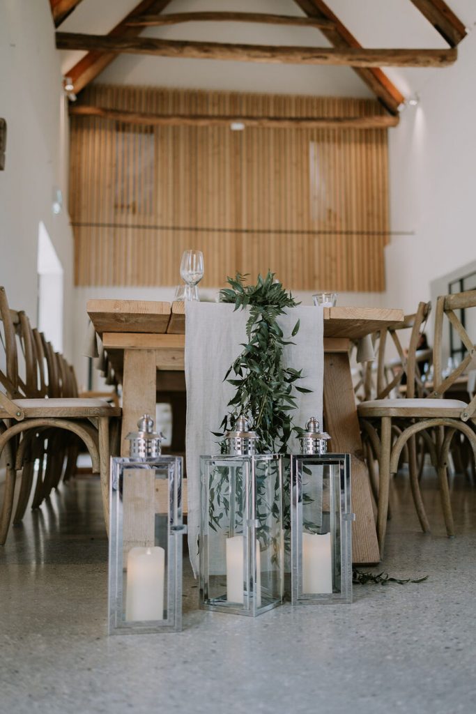 A warm, neutral colour palette with hints of wood, elevated with wildflowers and pampas