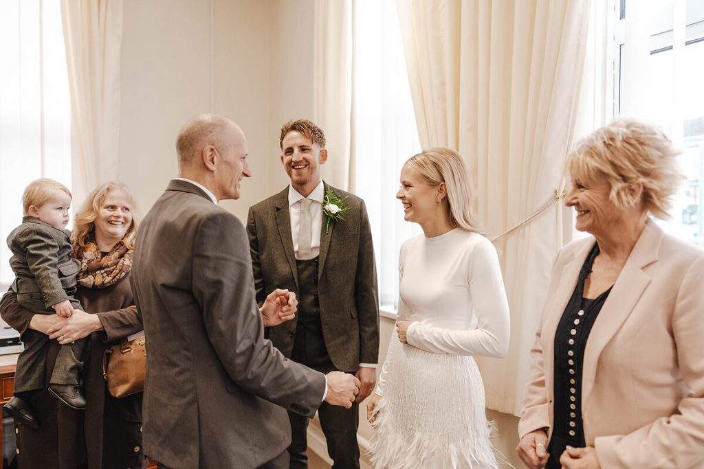 An intimate urban wedding featuring a dramatic Nadine Merabi skirt