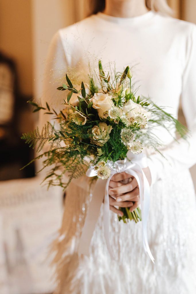 An intimate urban wedding featuring a dramatic Nadine Merabi skirt