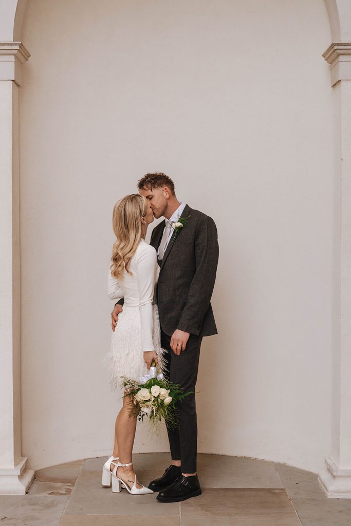 An intimate urban wedding featuring a dramatic Nadine Merabi skirt