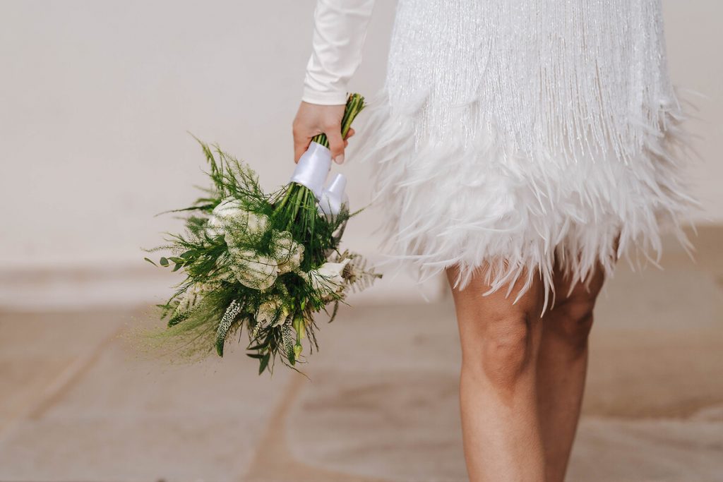 An intimate urban wedding featuring a dramatic Nadine Merabi skirt