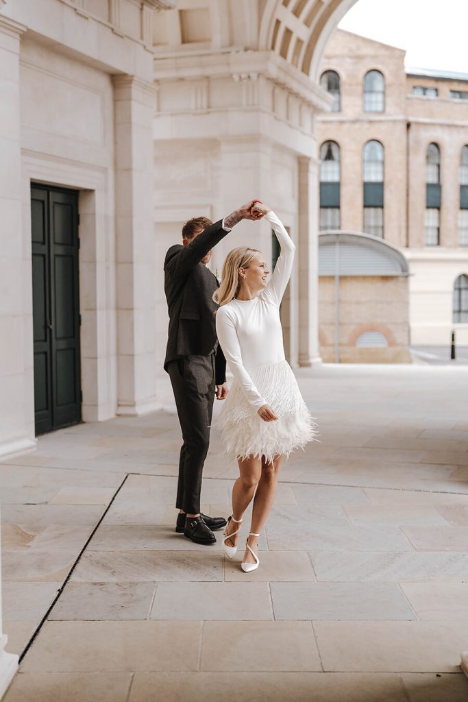 An intimate urban wedding featuring a dramatic Nadine Merabi skirt