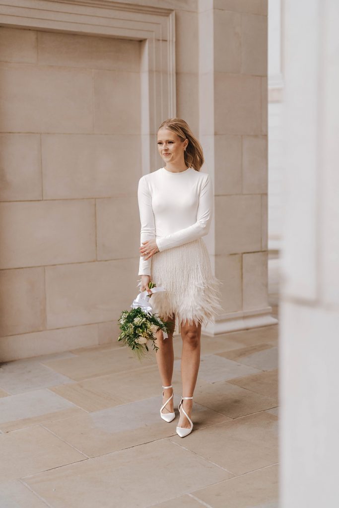 An intimate urban wedding featuring a dramatic Nadine Merabi skirt