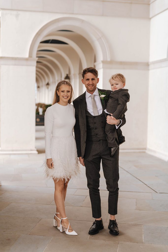 A Nadine Merabi skirt with hand beaded embellishments and a dramatic feather trim for an intimate urban wedding