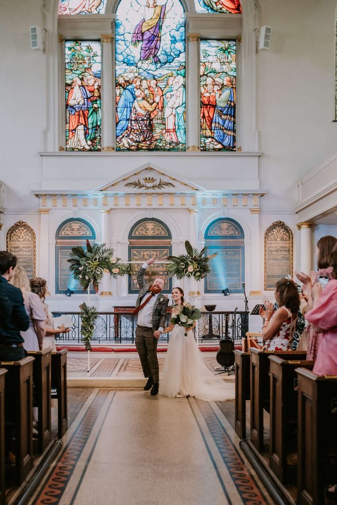 A joyous Church exit for Tess + David following their uplifting London wedding ceremony