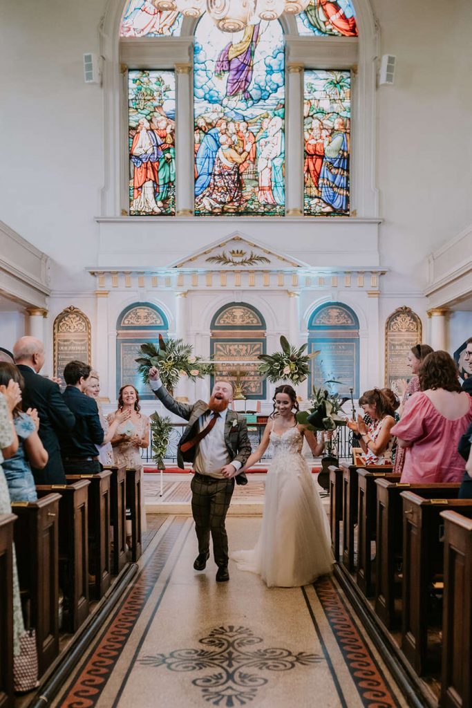 A joyous Church exit for Tess + David following their uplifting London wedding ceremony